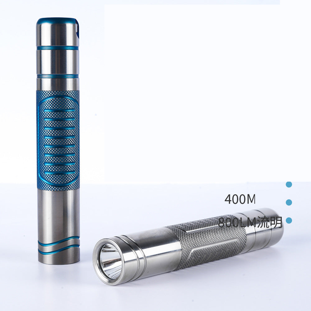 Titanium alloy ultra-bright flashlight with magnetic charging and secure magnetic attachment, designed for rugged durability and versatile hands-free illumination