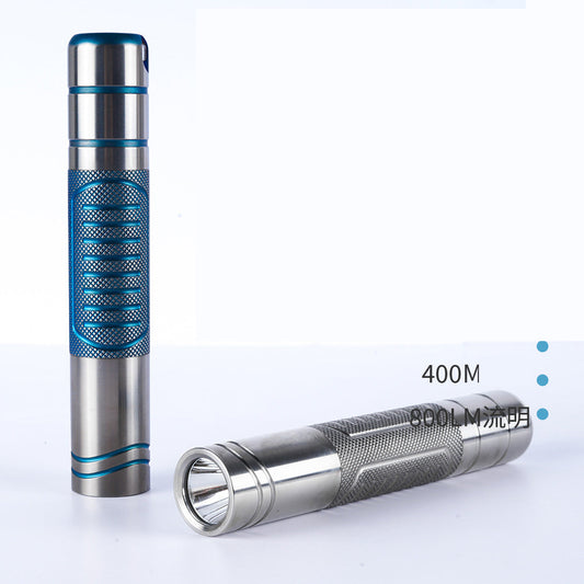 Titanium alloy ultra-bright flashlight with magnetic charging and secure magnetic attachment, designed for rugged durability and versatile hands-free illumination