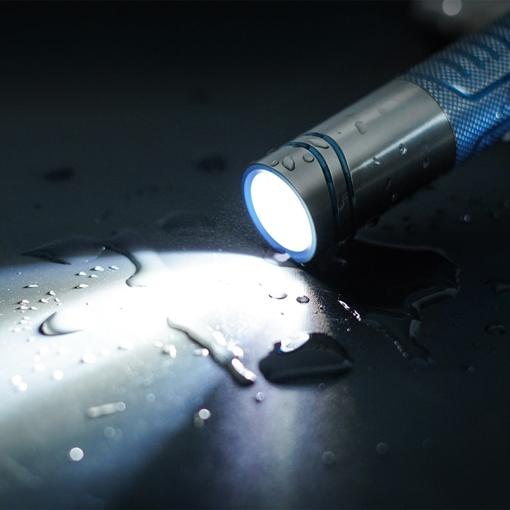 Titanium alloy ultra-bright flashlight with magnetic charging and secure magnetic attachment, designed for rugged durability and versatile hands-free illumination